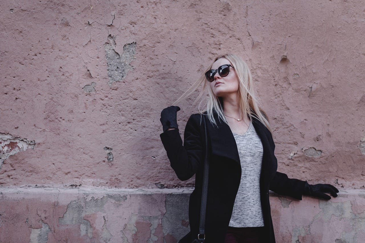 A pink wall and a pink coat: tonal dressing in the wild.